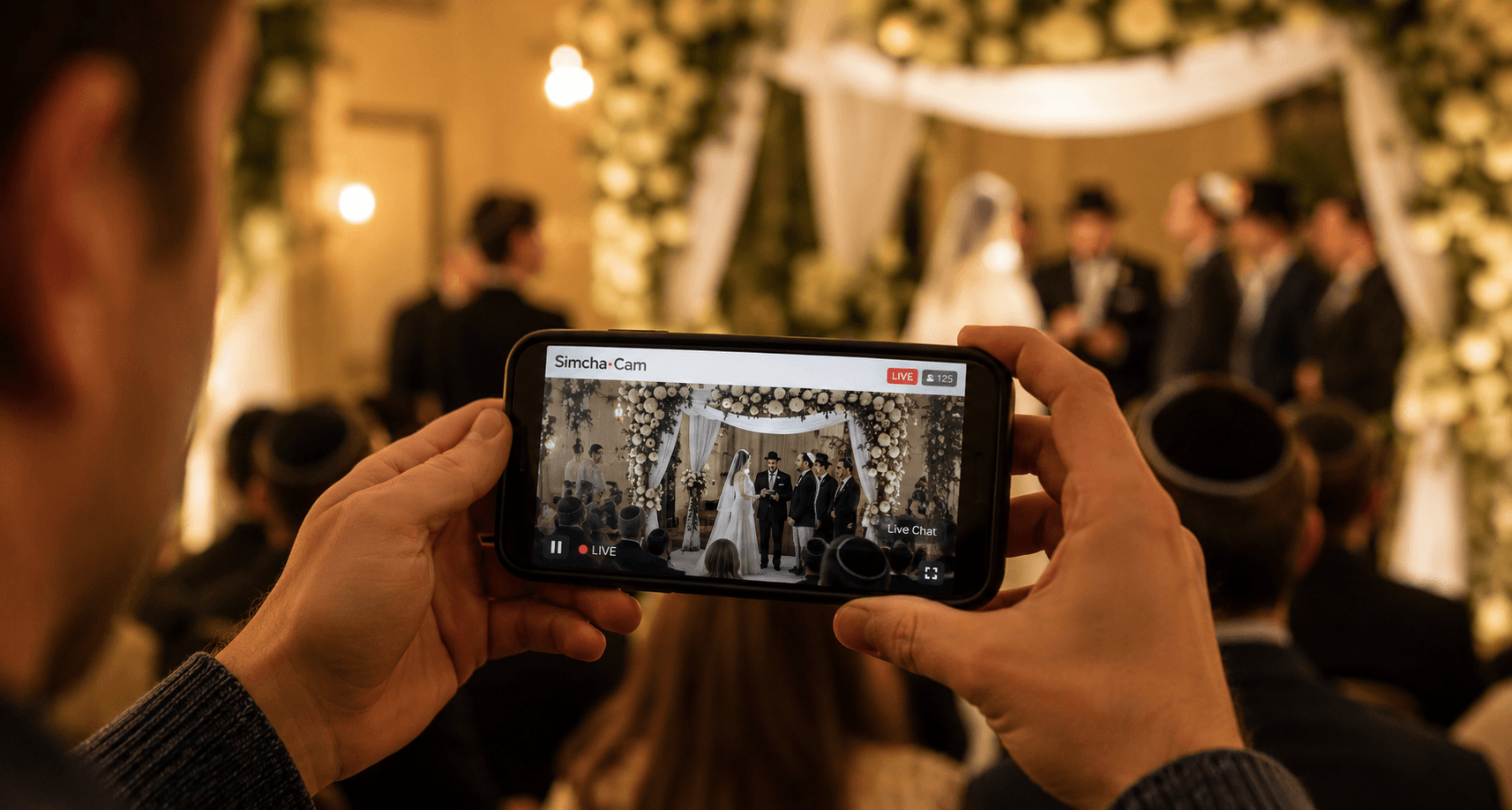 A wedding celebration being livestreamed through a phone
